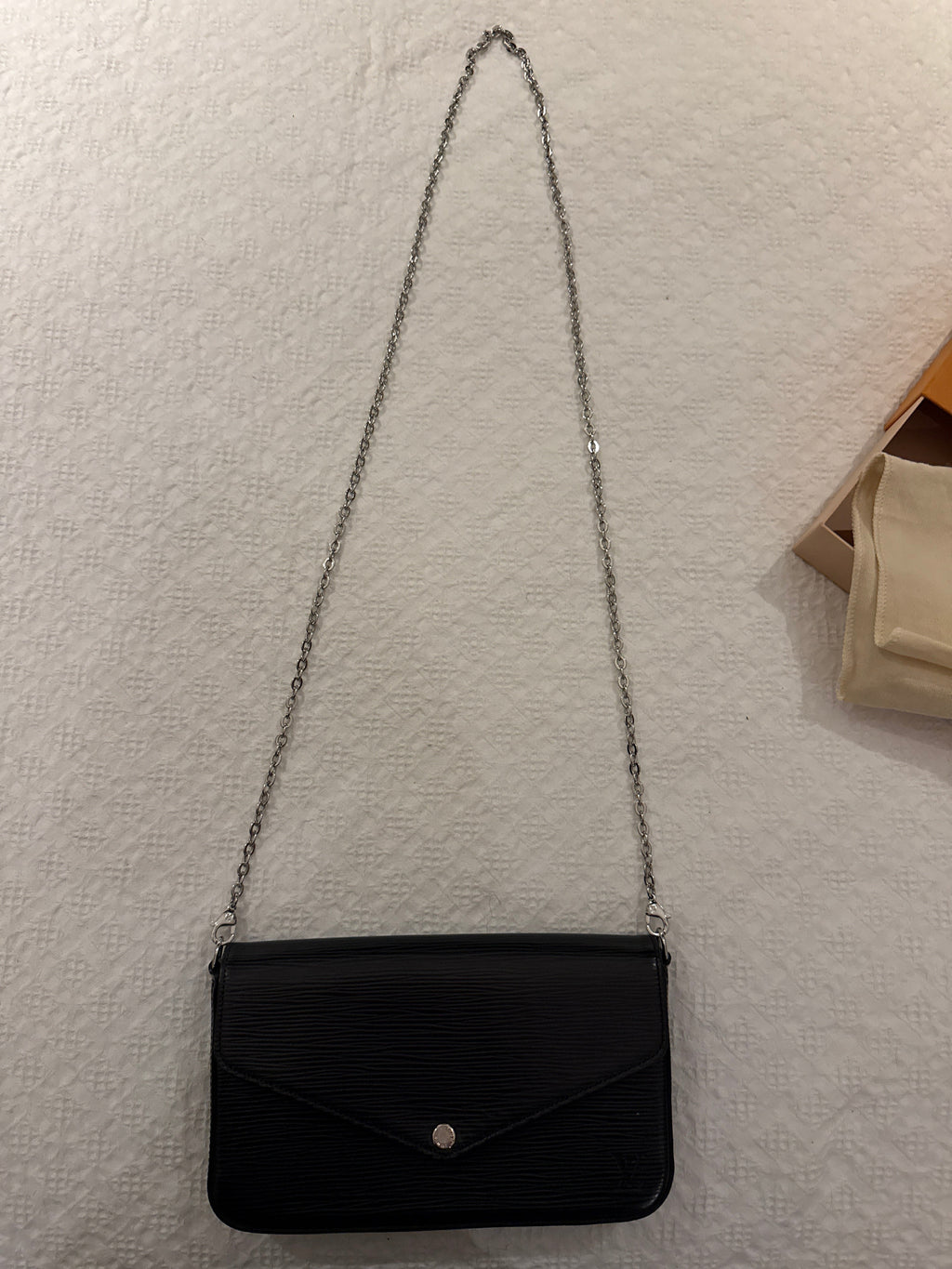 Louis Vuitton Pochette Félicie in black, black interior. 
EPI leather with a silver-tone chain strap